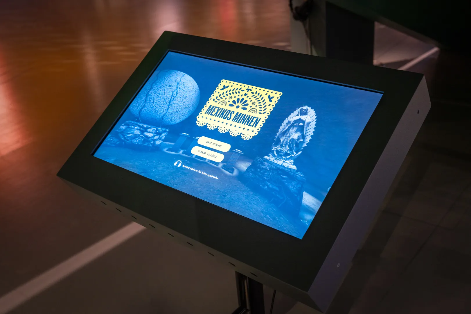 Visitor using touchscreen to explore the WebXR experience