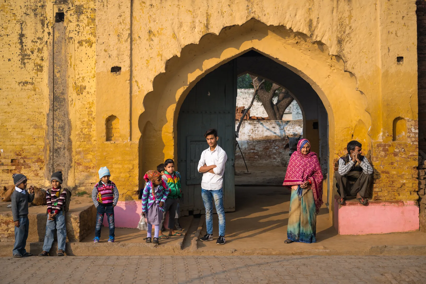 Community members going about daily routines by the river